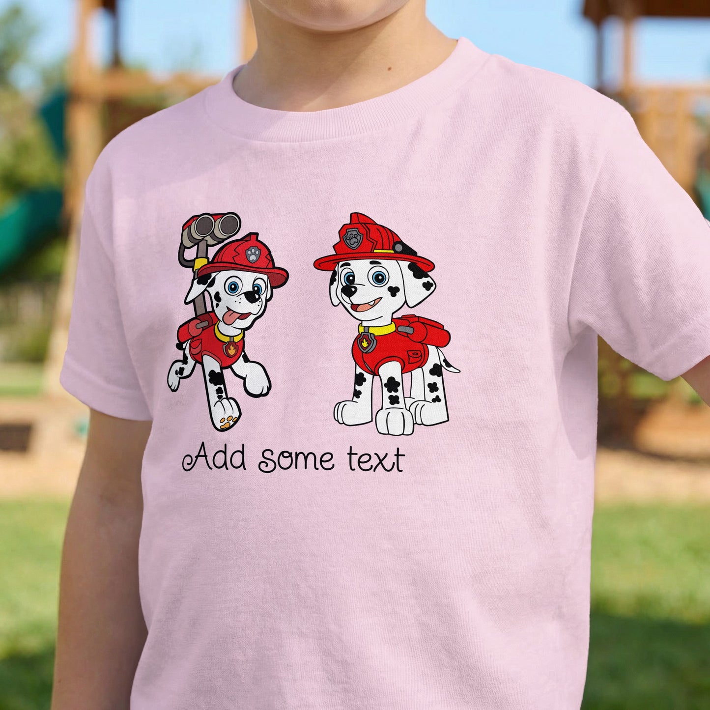 Pink t-shirt with cartoon dogs in firefighter gear and text.