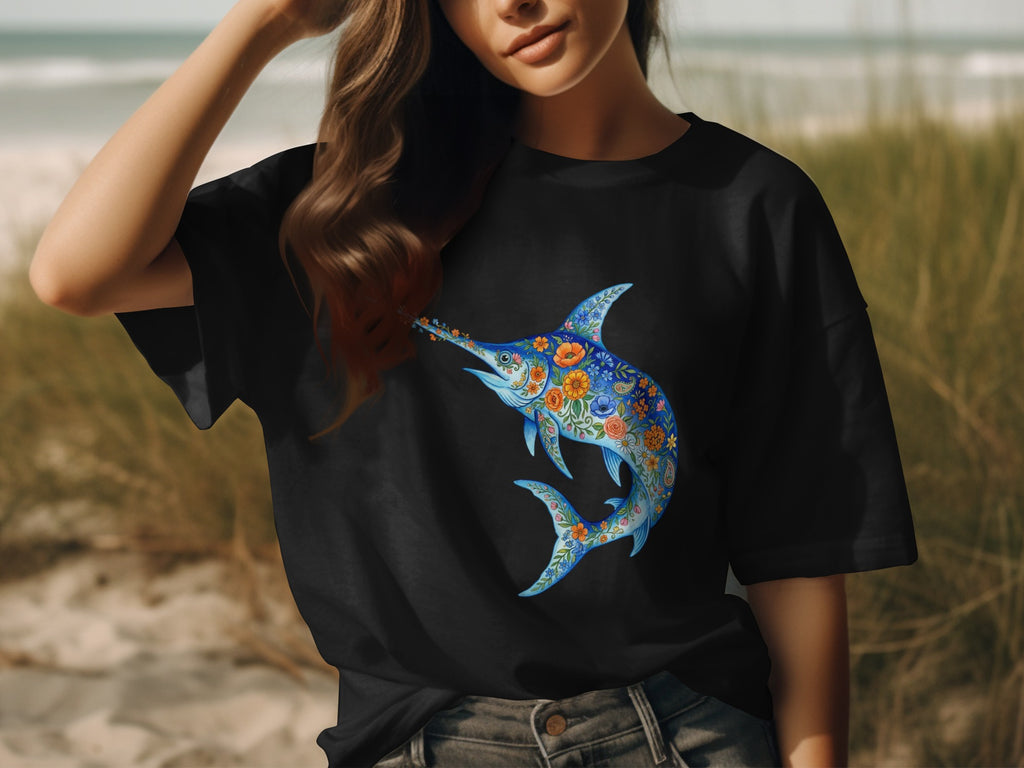 Black t-shirt with a blue floral swordfish design on the chest.