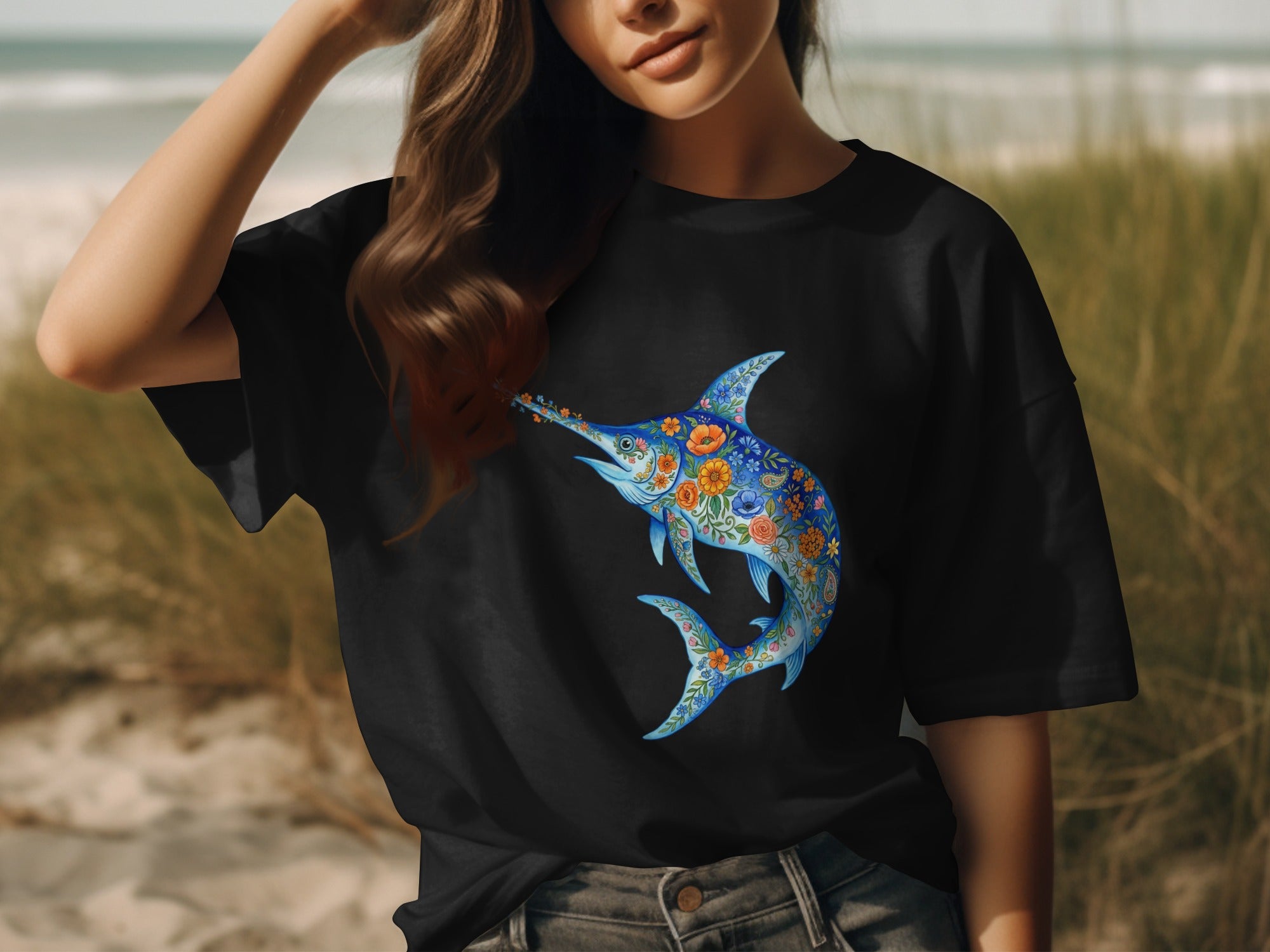 Black t-shirt with a blue floral swordfish design on the chest.