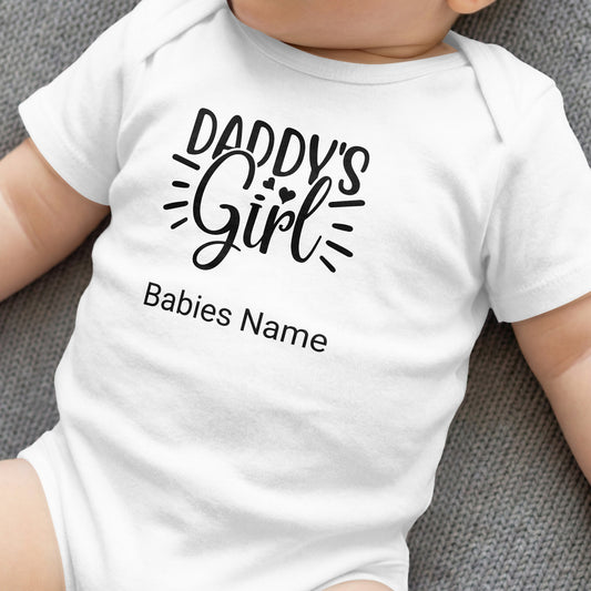 White baby onesie with "DADDY'S Girl" and "Babies Name" text.
