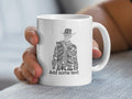 White mug with silhouette filled with Western-themed words.