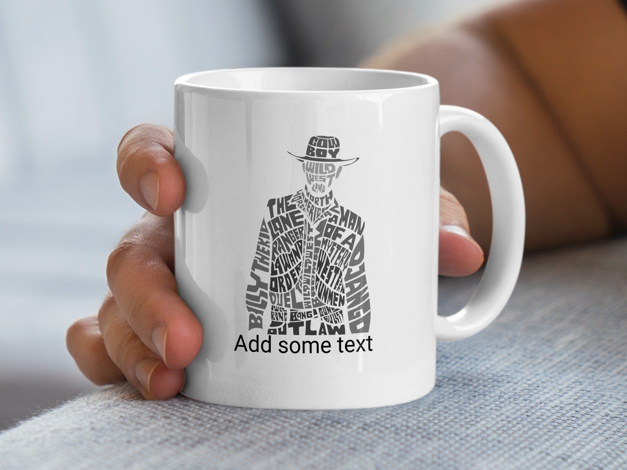 White mug with silhouette filled with Western-themed words.