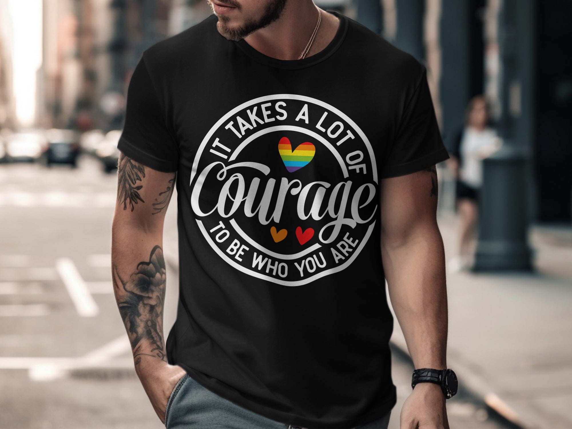 Black t-shirt with "It Takes A Lot Of Courage To Be Who You Are" text and rainbow heart.