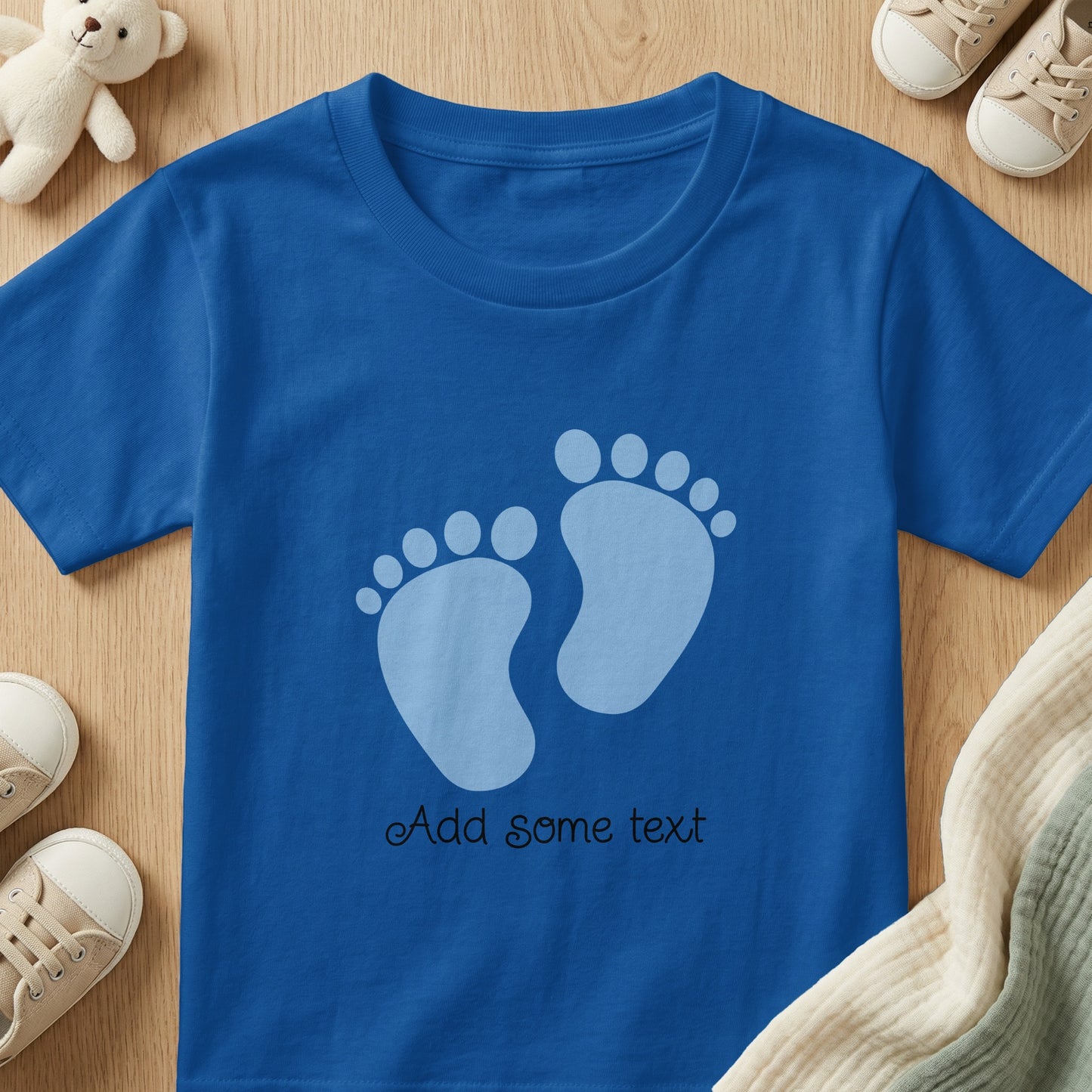 Blue t-shirt with two pale blue footprints and "Add some text"