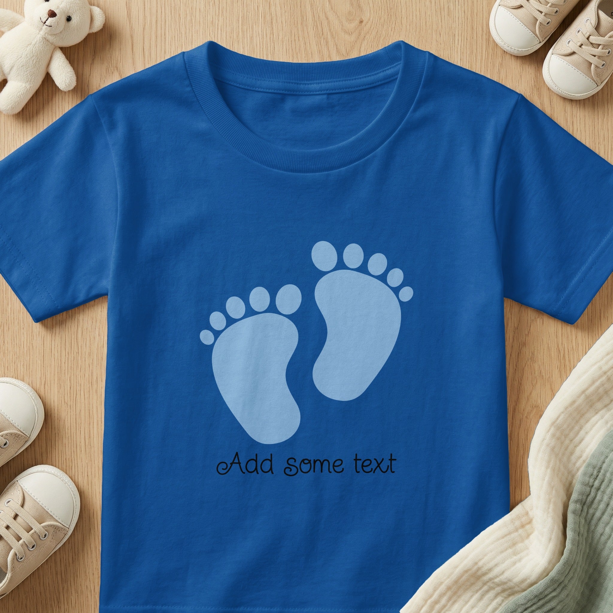 Blue t-shirt with two pale blue footprints and "Add some text"