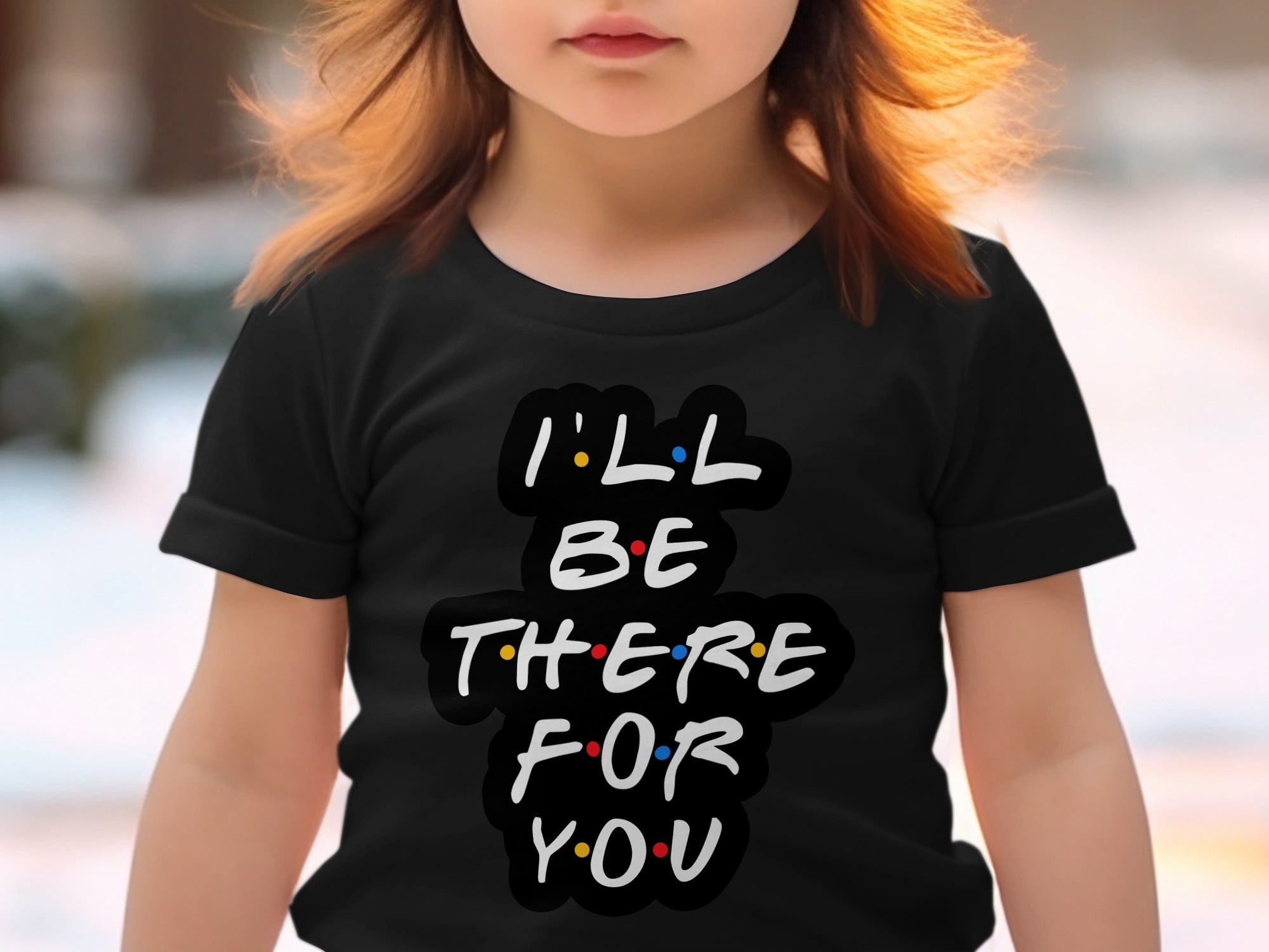 Close-up of a child wearing a black t-shirt with "I'LL BE THERE FOR YOU" text.