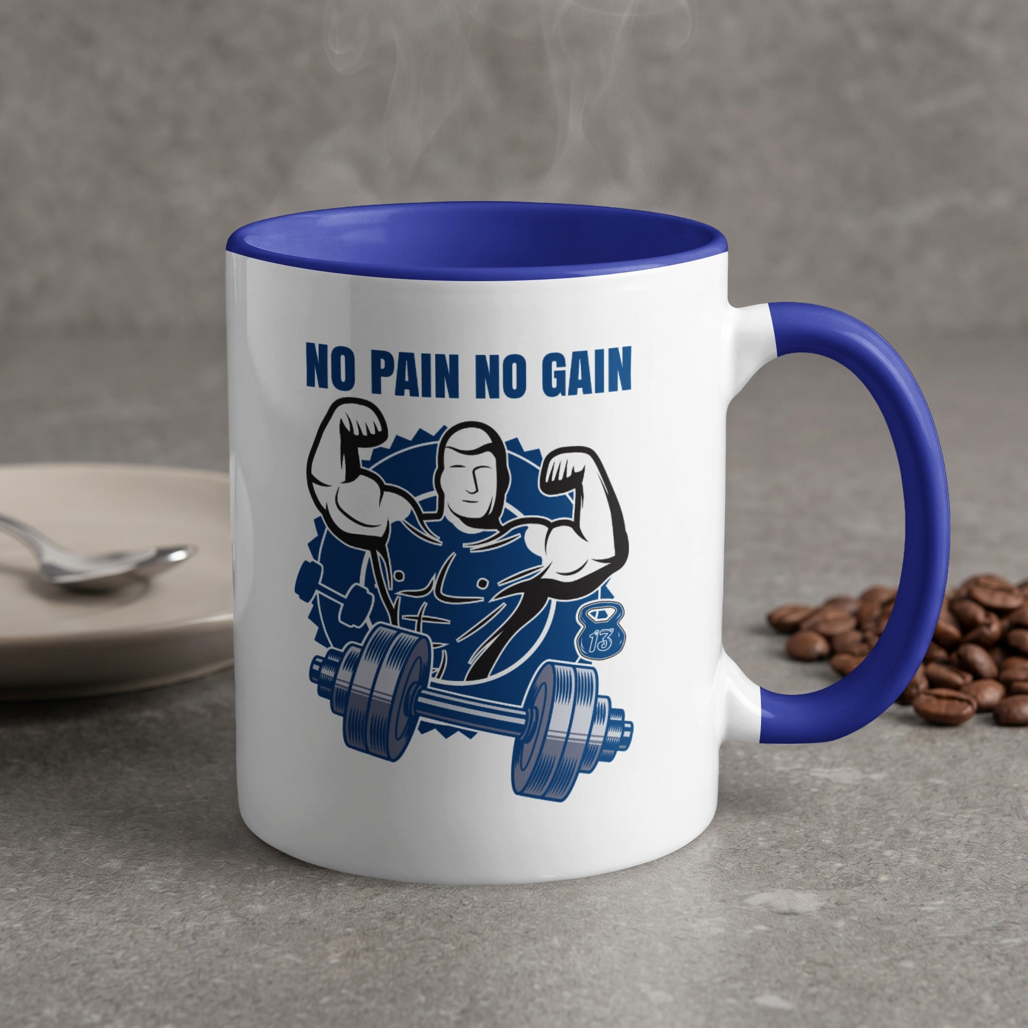 White mug with blue rim, "NO PAIN NO GAIN" and bodybuilder with dumbbell graphic.