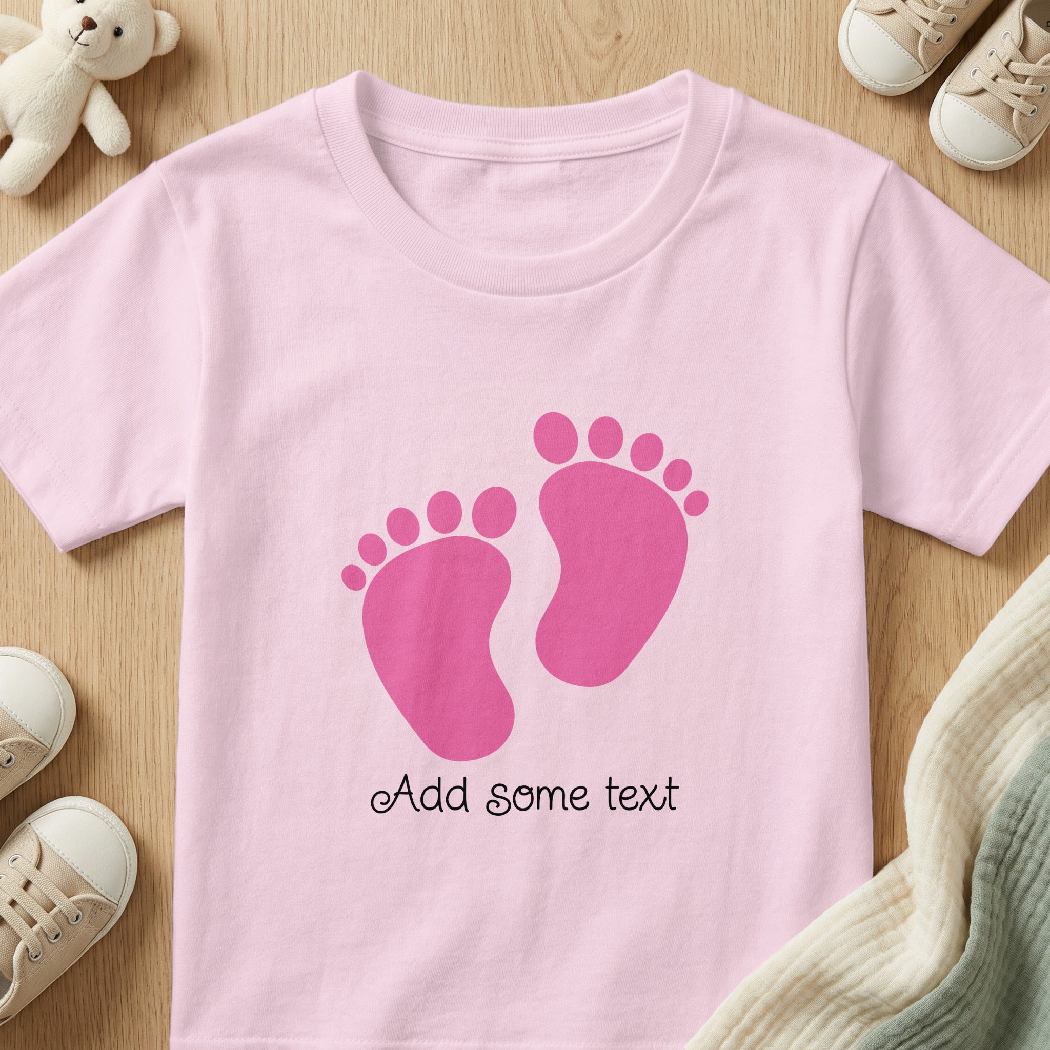 Pink baby bodysuit with pink footprint graphic and "Add some text" placeholder.
