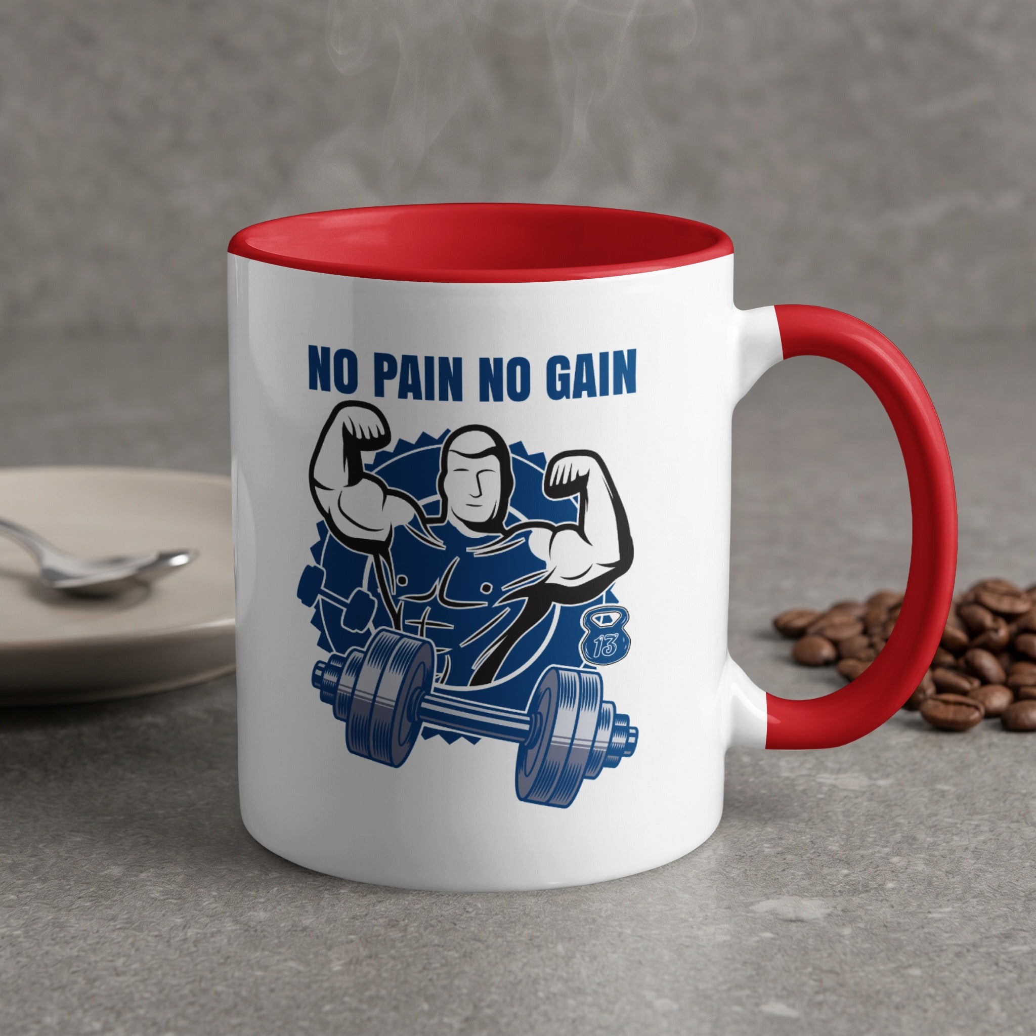 White mug with red handle, text "NO PAIN NO GAIN", and graphic of a muscular man lifting weights.